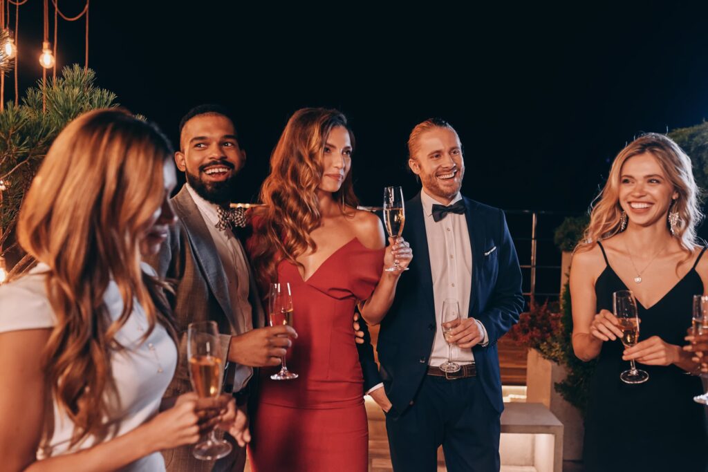 Group,Of,Beautiful,People,In,Formalwear,Communicating,And,Smiling,While